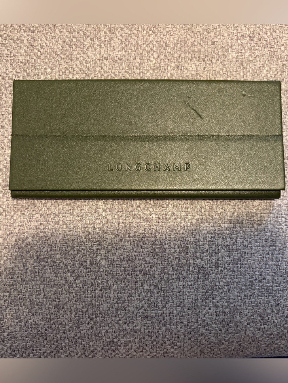 LONGCHAMP- semi-hard shell folding eyeglasses case in olive green.